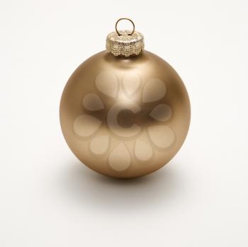 Royalty Free Photo of a Still Life of a Gold Christmas Ornament