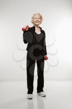 Royalty Free Photo of an Older Woman Lifting Weights