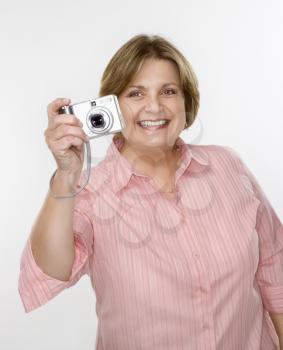 Royalty Free Photo of a Woman Taking a Photo with a Digital Camera