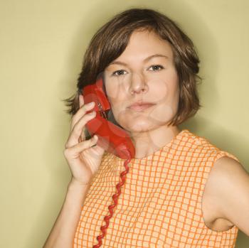 Royalty Free Photo of a Woman Holding a Telephone Receiver