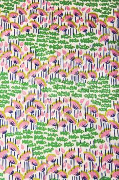 Royalty Free Photo of a Close-up of Vintage Fabric With Pink Flowers and Green Fish Printed on Polyester