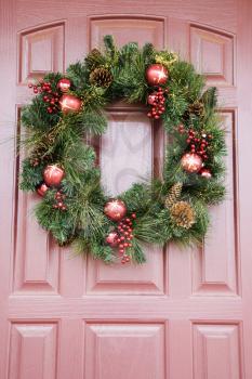 Christmas wreath hanging on door.