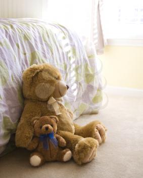 Royalty Free Photo of Teddy Bears on a Bedroom Floor