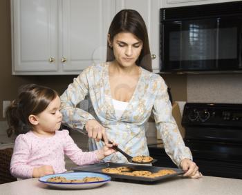 Royalty Free Photo of a Mother and Daughter Baking Cookies