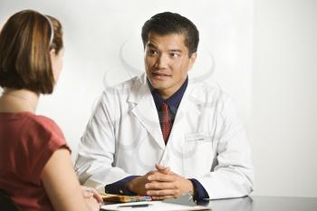 Royalty Free Photo of
a Doctor Consulting With a Patient