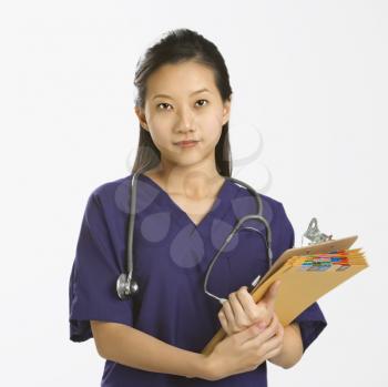 Royalty Free Photo of a Female Doctor Holding Files