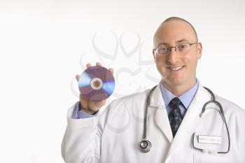 Royalty Free Photo of a Physician Holding a Compact Disc