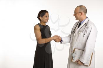 Royalty Free Photo of a Doctor Shaking Hands With a Patient