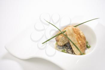 Royalty Free Photo of Escargot en Croute With Butter and Fava Beans