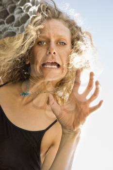 Royalty Free Photo of a Woman Making a Funny Facial Expression
