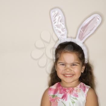 Royalty Free Photo of a Girl Wearing Bunny Ears Smiling
