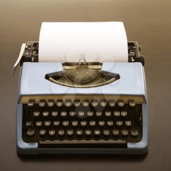 Royalty Free Photo of a Blank Sheet of Paper in an Old Fashioned Typewriter