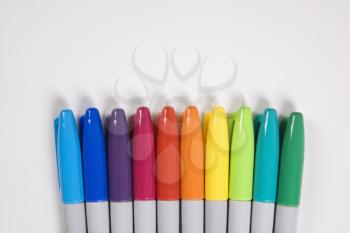 Royalty Free Photo of a Group of Colorful Markers Lined up in a Row