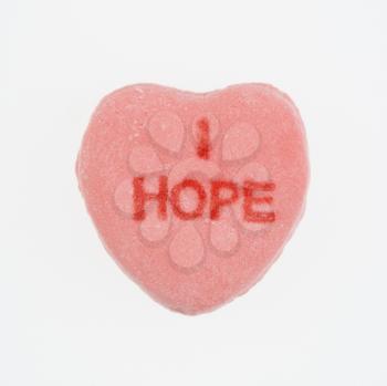Royalty Free Photo of a Pink Candy Heart That Reads I Hope