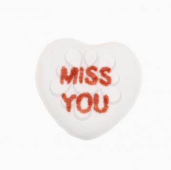 Royalty Free Photo of an Orange Candy Heart That Reads Miss You
