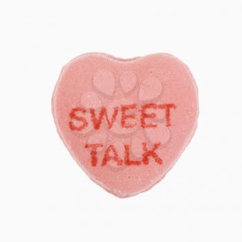 Royalty Free Photo of a Pink Candy Heart that Says Sweet Talk