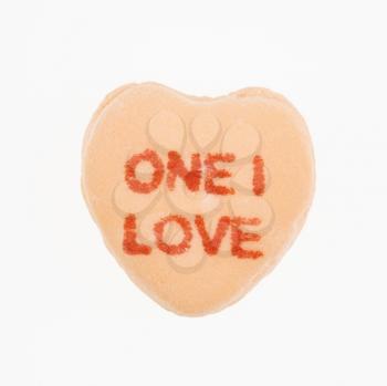 Royalty Free Photo of an Orange Candy Heart That Reads One I Love