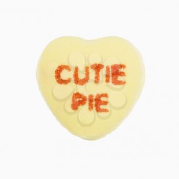 Royalty Free Photo of a Yellow Candy Heart That Reads Cutie Pie
