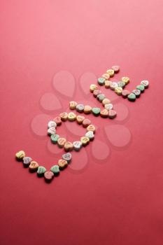Royalty Free Photo of Candy Hearts Arranged to Spell the Word Love
