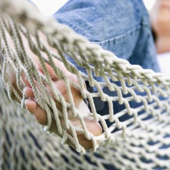 Royalty Free Photo of a Woman's Feet in a Hammock