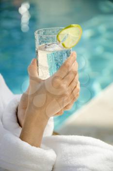 Royalty Free Photo of a Woman Holding a Glass of Water