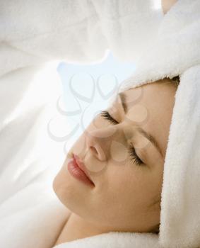 Royalty Free Photo of a Woman Wearing a Towel on Her Head With Eyes Closed Relaxing