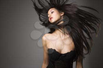 Royalty Free Photo of a Woman Flinging Her Hair