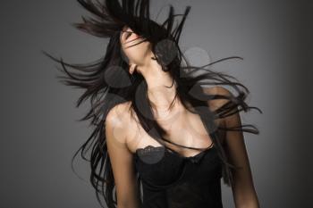 Royalty Free Photo of a Woman Flinging Her Hair