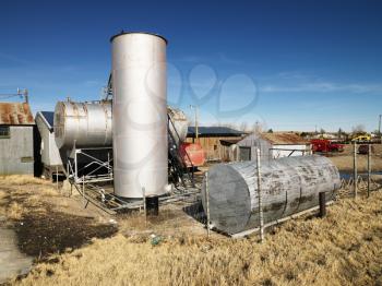 Royalty Free Photo of a Rural Landscape With Metal Tanks