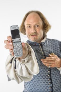 Royalty Free Photo of William Shakespeare in Period Clothing Holding Out a Cellphone