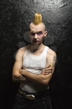 Royalty Free Photo of a Male Punk With Arms Crossed