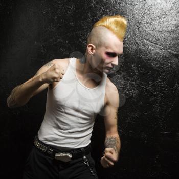 Royalty Free Photo of a Punk With Clenched Fists
