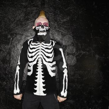 Royalty Free Photo of a Male Punk Wearing a Skeleton Sweatshirt and Bandanna