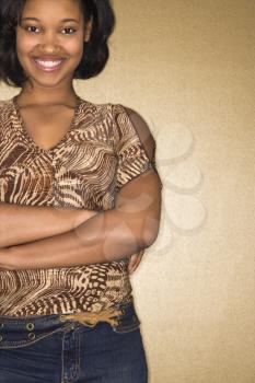 Royalty Free Photo of a Woman Standing With Her Arms Crossed