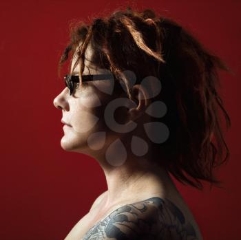 Royalty Free Photo of Profile Portrait of a Woman with Tattoos