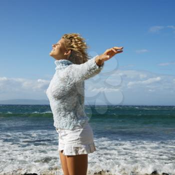 Royalty Free Photo of a Woman Standing on a Beach in Hawaii