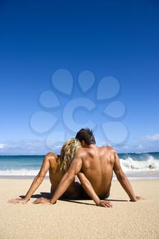 Royalty Free Photo of a Couple Sitting on a Maui, Hawaii Beach