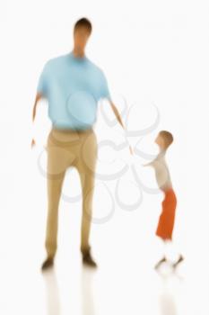 Royalty Free Photo of a Soft Focus of a Father Holding His Son's Hand