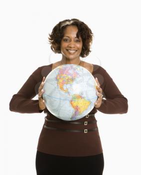 Royalty Free Photo of a Woman Holding a World Globe