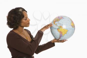 Royalty Free Photo of a Woman Holding a World Globe Out Between Her Hands