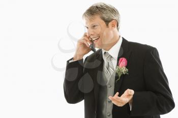 Royalty Free Photo of a Groom Talking on a Cellphone