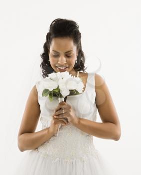 Royalty Free Photo of a Bride Holding A Bouquet 