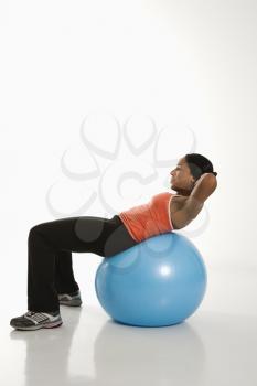 Royalty Free Photo of a Woman Exercising on a Balance Ball
