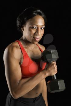 Royalty Free Photo of a Woman Lifting a Dumbbell