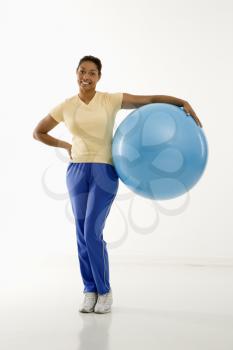 Royalty Free Photo of a Woman Holding an Exercise Ball