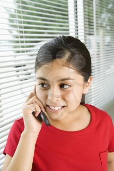 Royalty Free Photo of a Preteen Girl Talking on a Cellphone