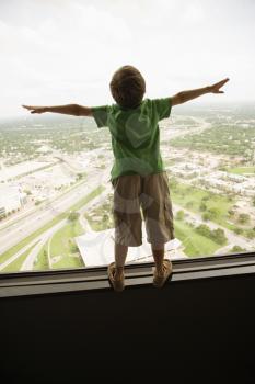 Royalty Free Photo of a Boy Standing on an Observation Deck at the Tower of the Americas in San Antonio, Texas