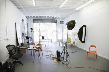 Royalty Free Photo of a Photography Studio With Lights and Various Equipment and Props