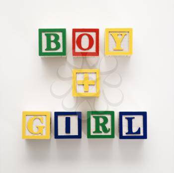 Royalty Free Photo of Alphabet Building Blocks Spelling Boy and Girl