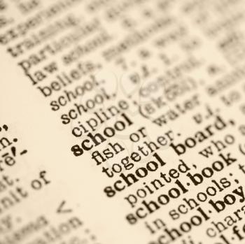 Royalty Free Photo of a Selective Focus of a Dictionary Definition for The Word School